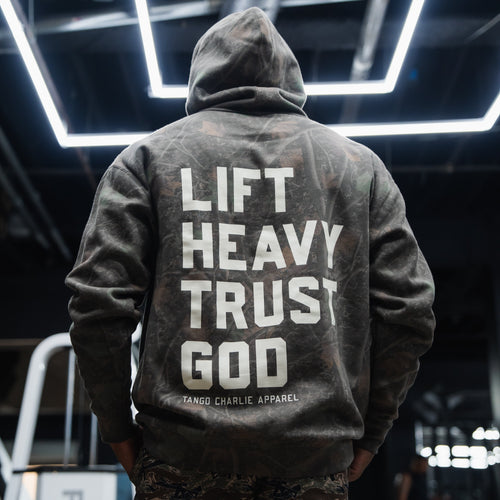 Lift Heavy. Trust God. - Premium Darkwood Camo Hoodie Hoodies military apparel sticker patch aviation funny custom usmc navy best military aviation apparel patches and motto gym workout garage flags t-shirt mens