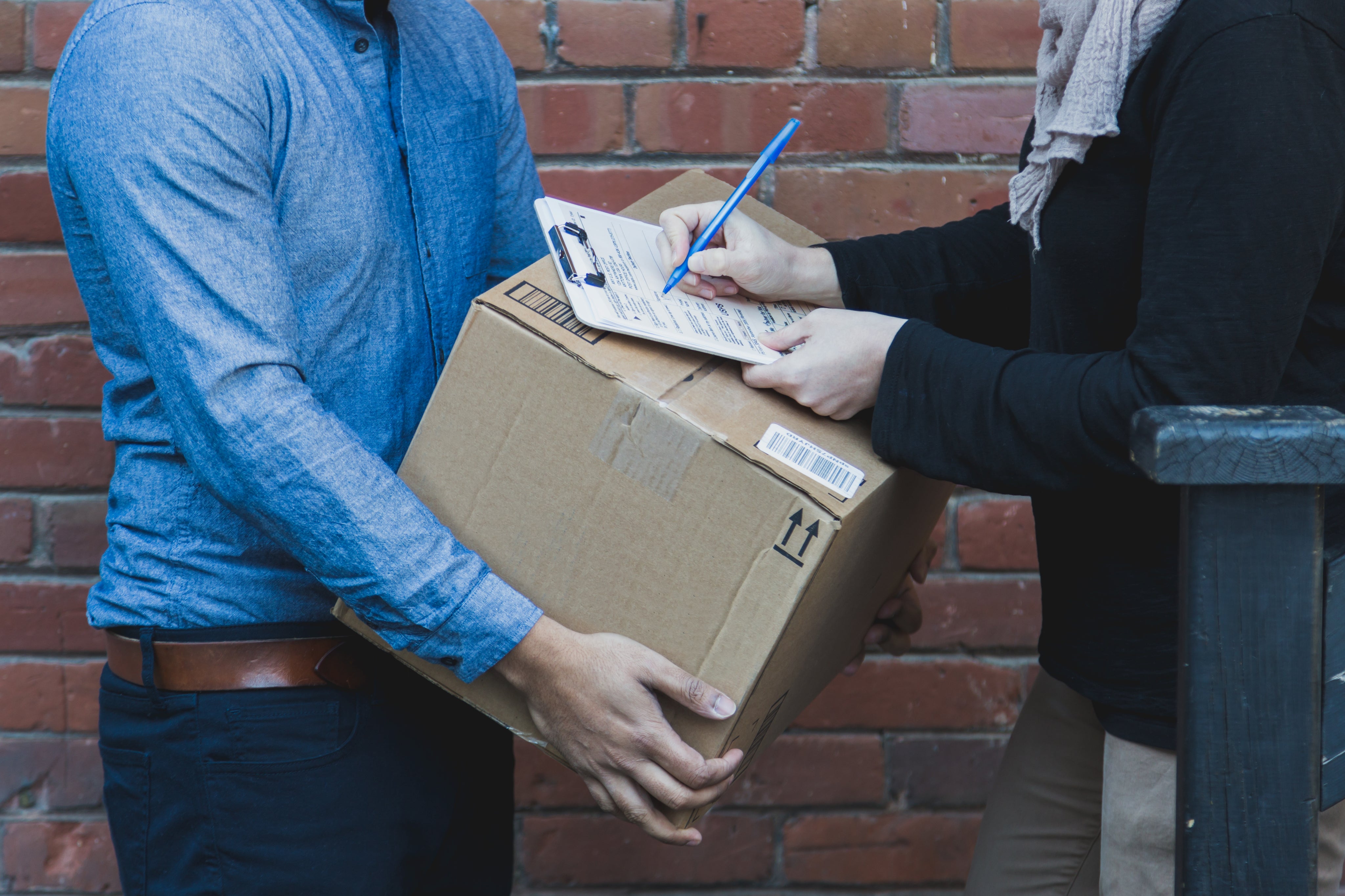man-signing-for-shipping-box.jpg